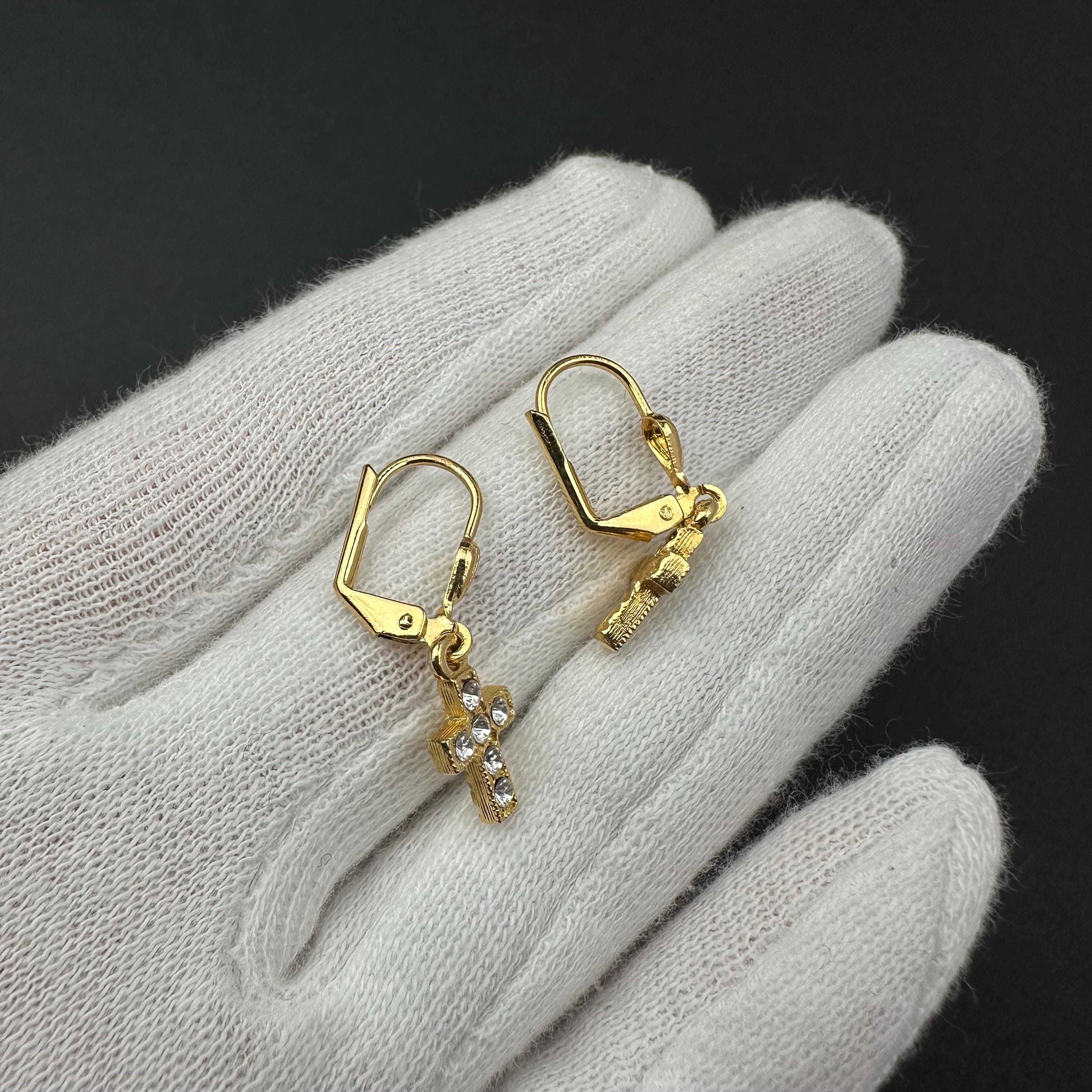 Vintage 1928 gold tone cross drop earrings with clear rhinestones