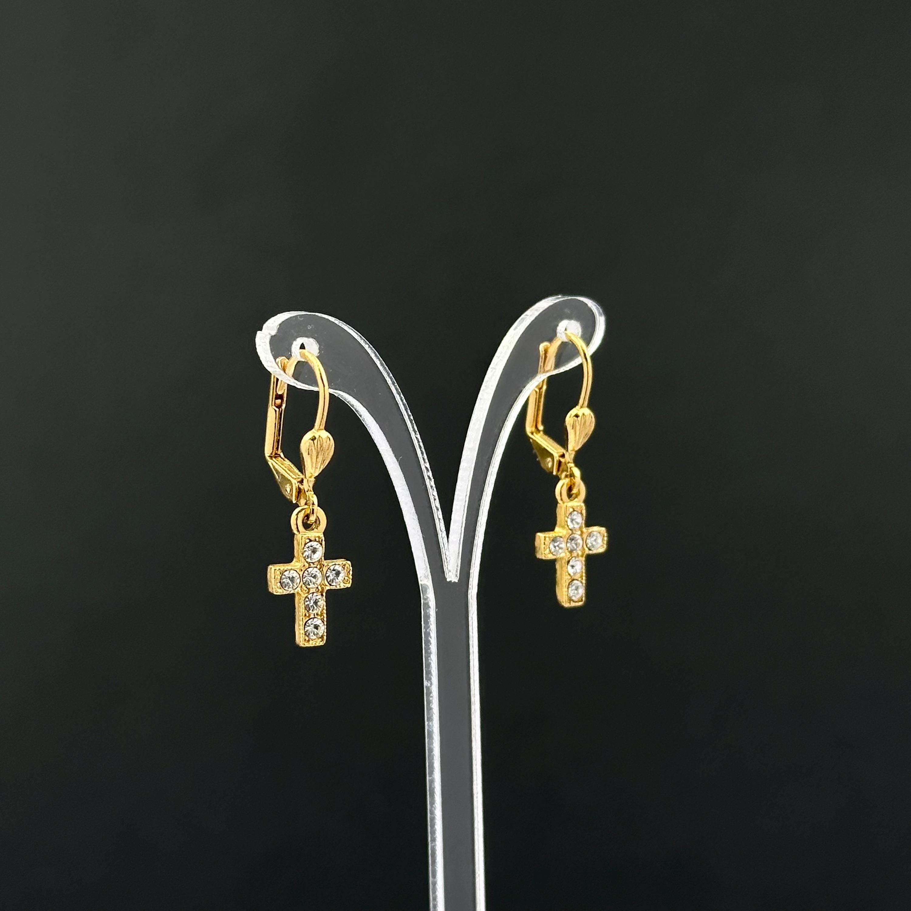 Vintage 1928 gold tone cross drop earrings with clear rhinestones