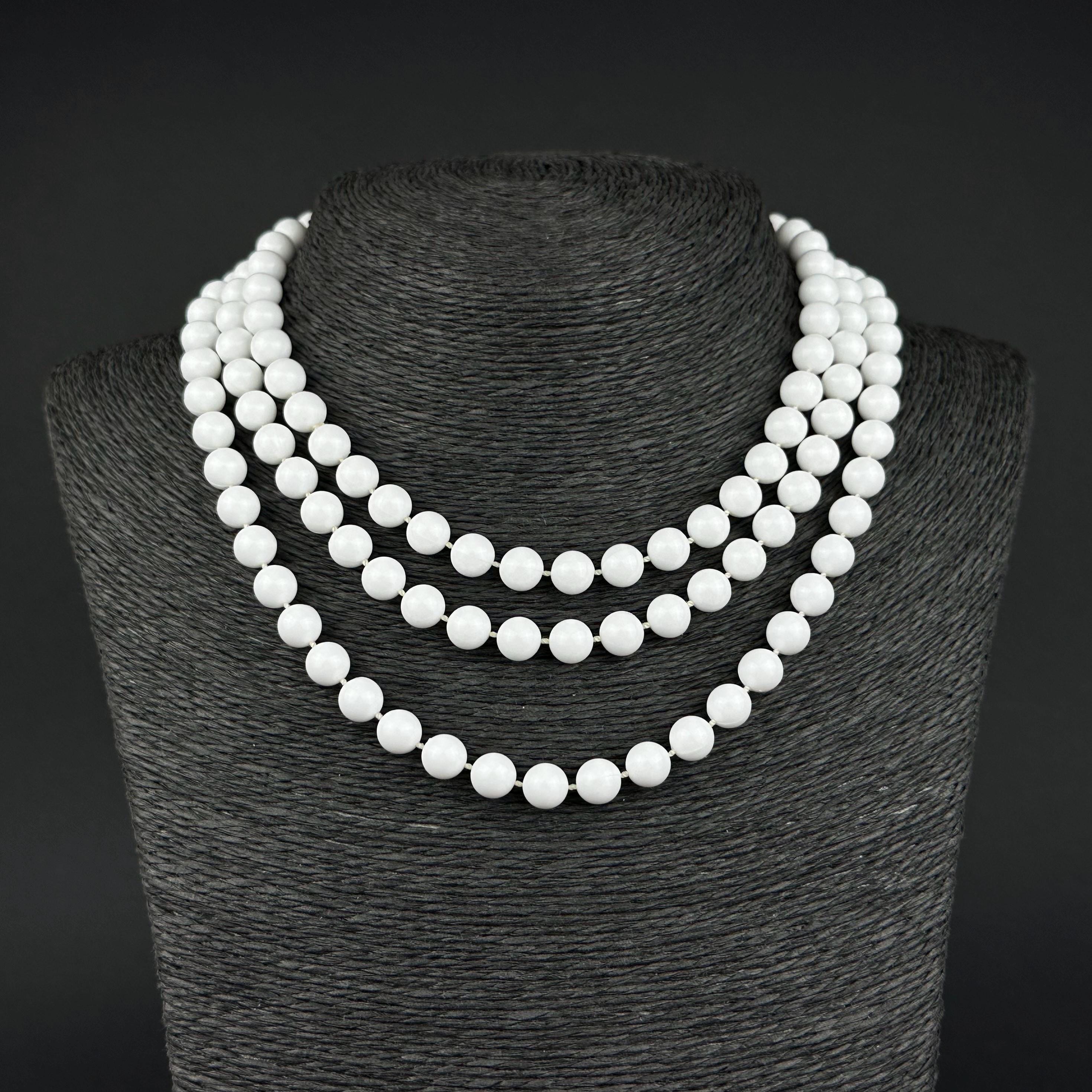 Vintage long white plastic bead necklace