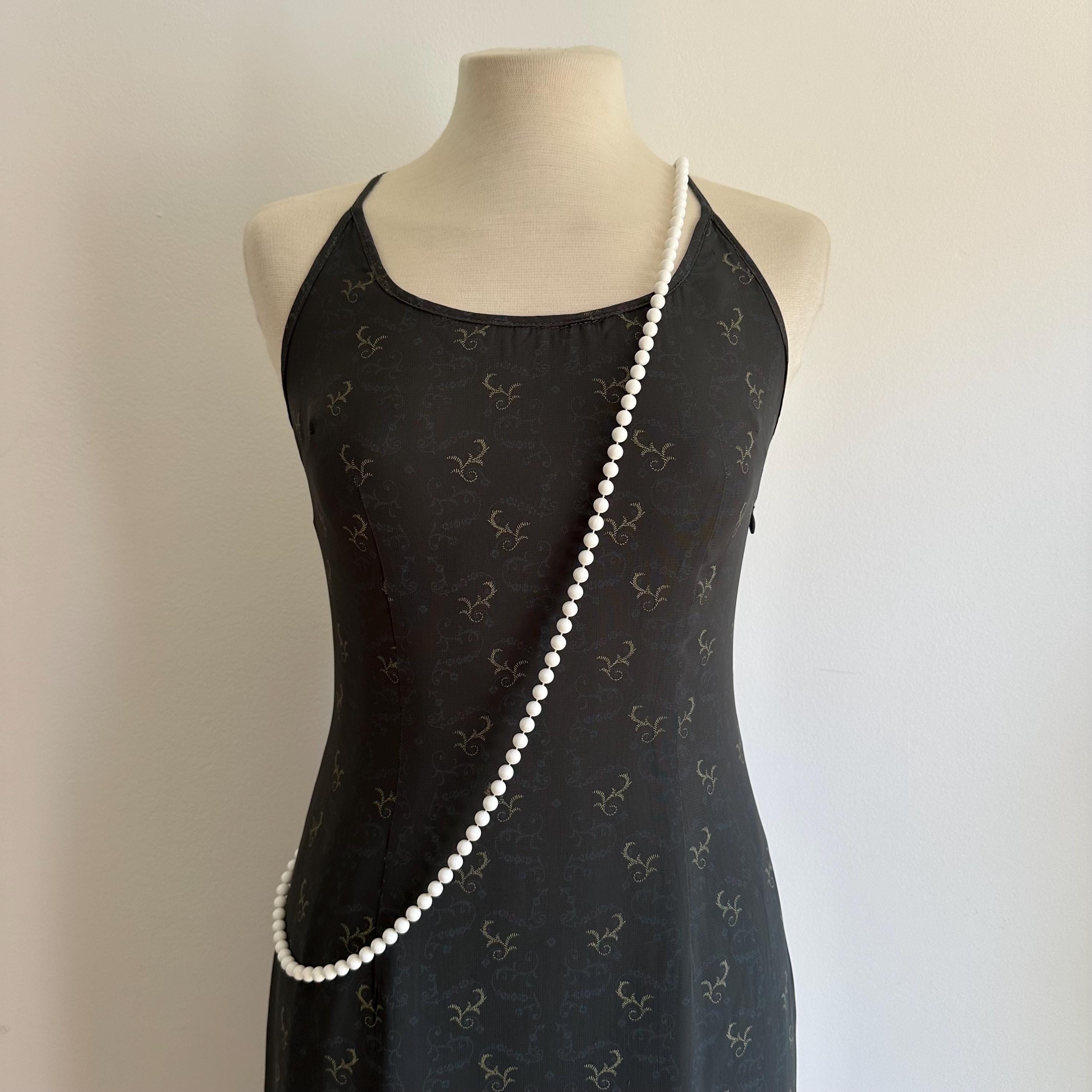 Vintage long white plastic bead necklace
