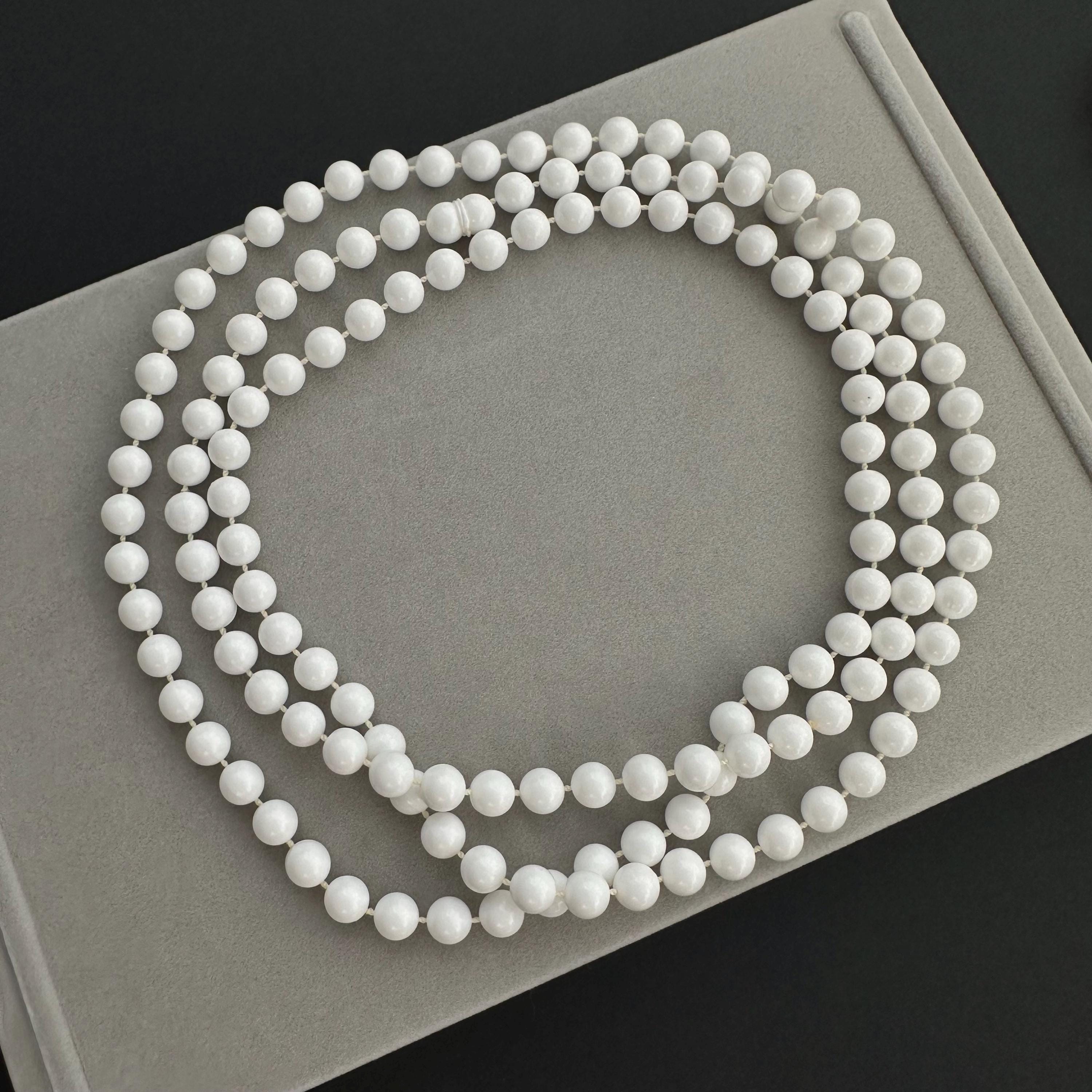 Vintage long white plastic bead necklace