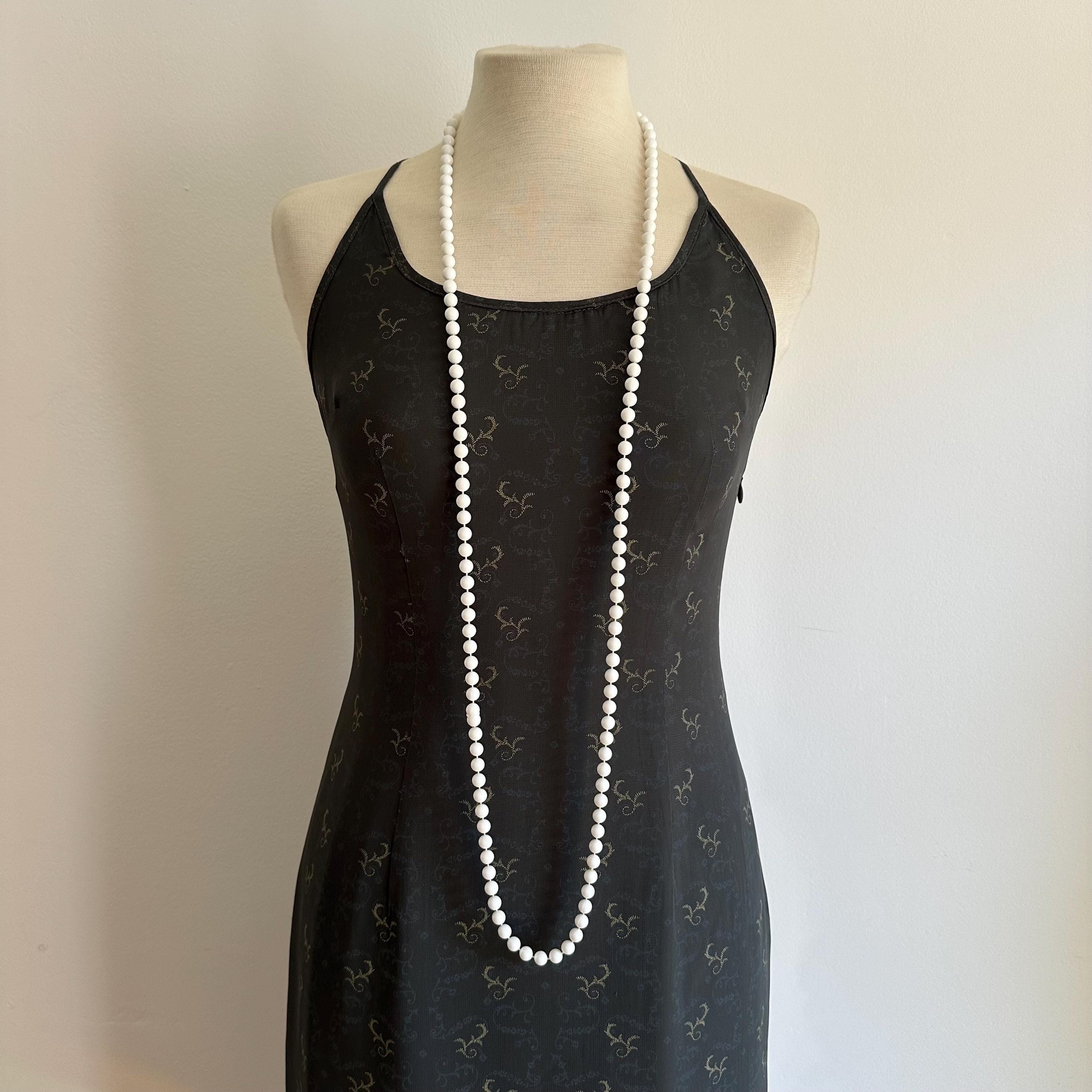 Vintage long white plastic bead necklace
