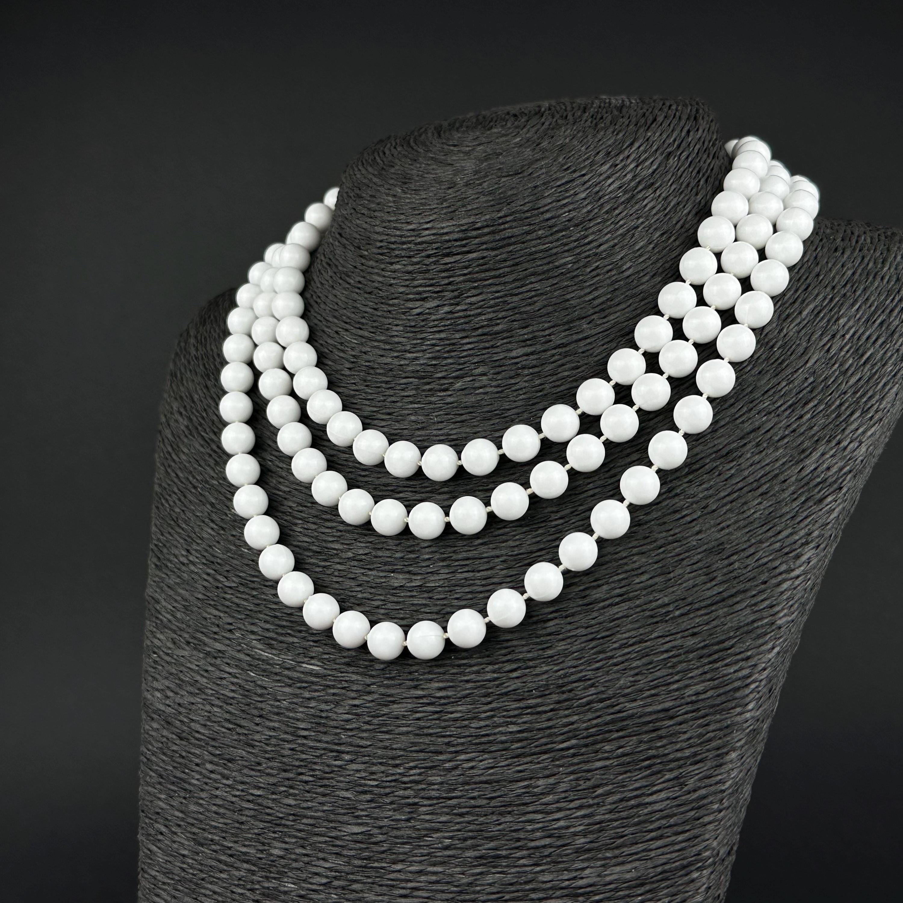 Vintage long white plastic bead necklace