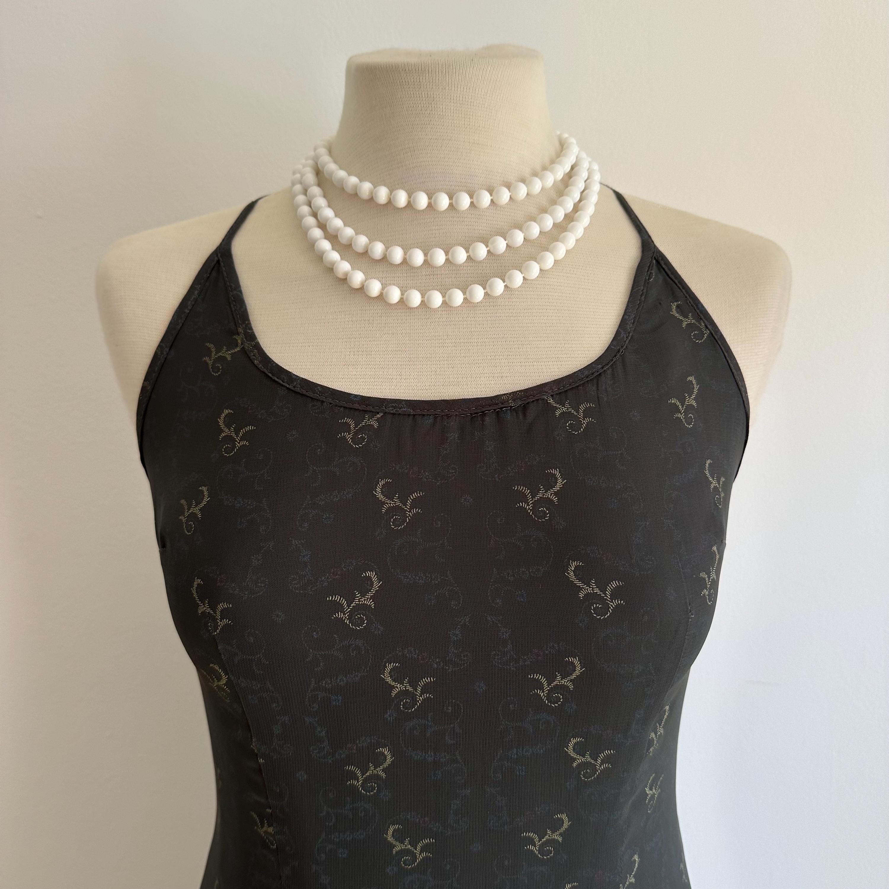 Vintage long white plastic bead necklace