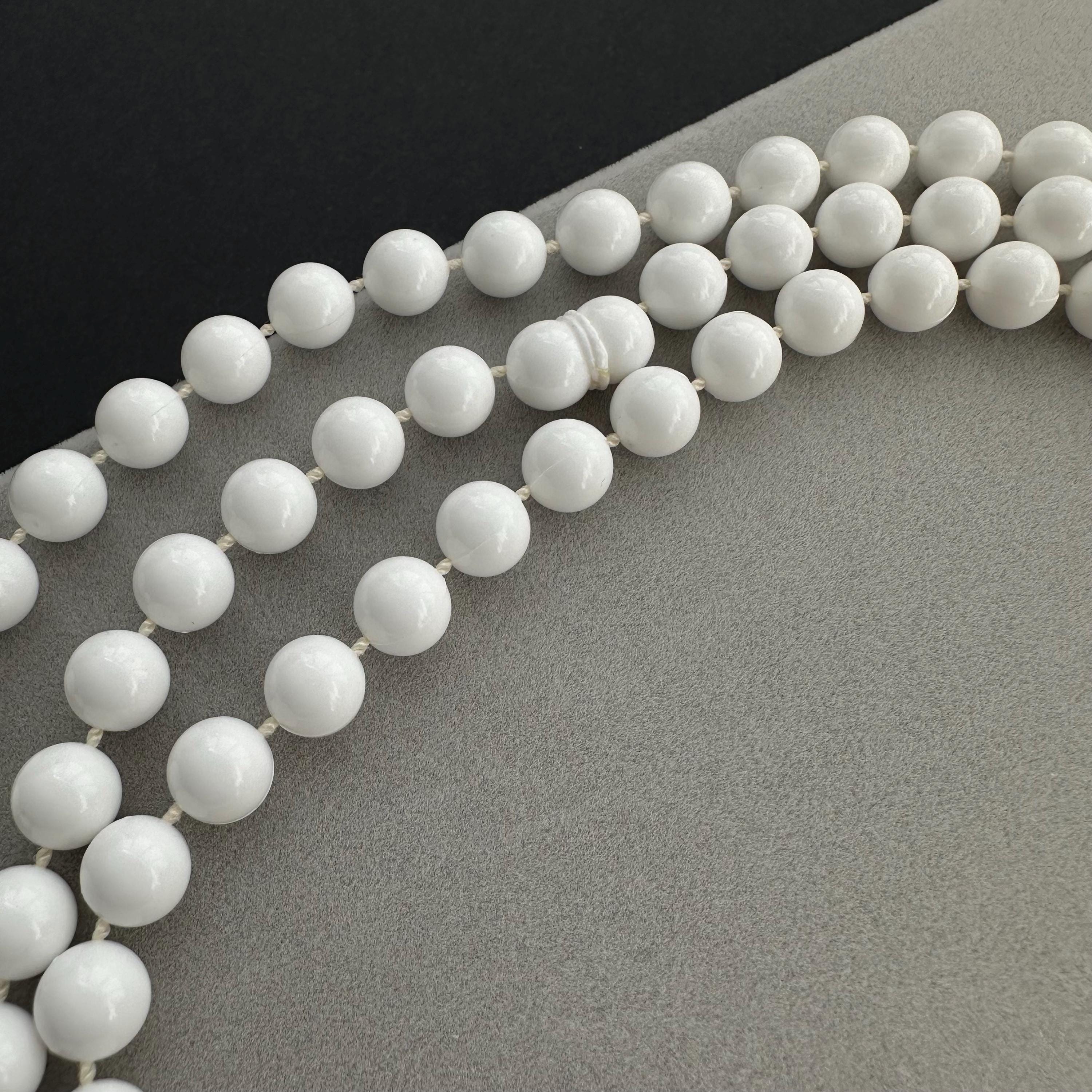 Vintage long white plastic bead necklace