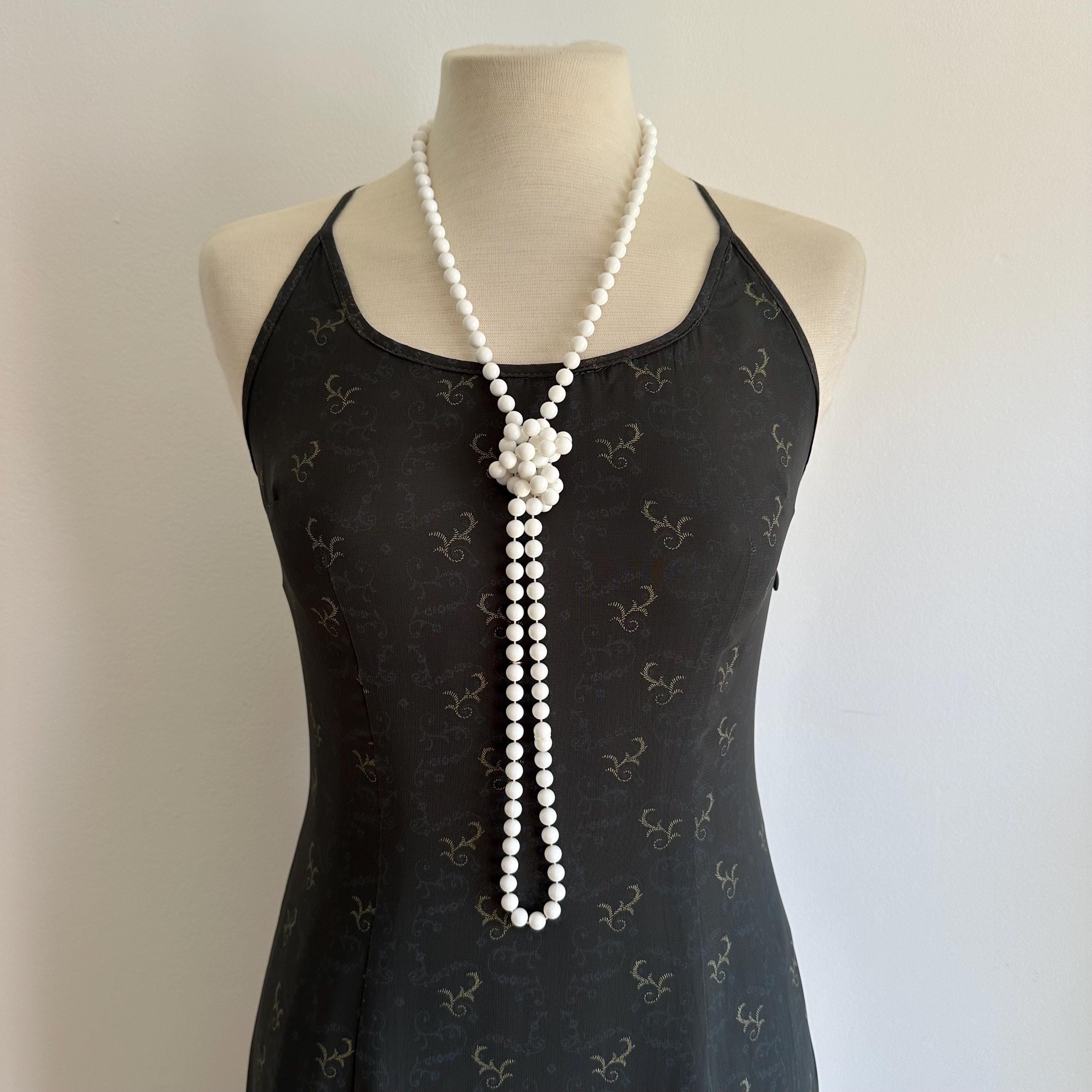 Vintage long white plastic bead necklace