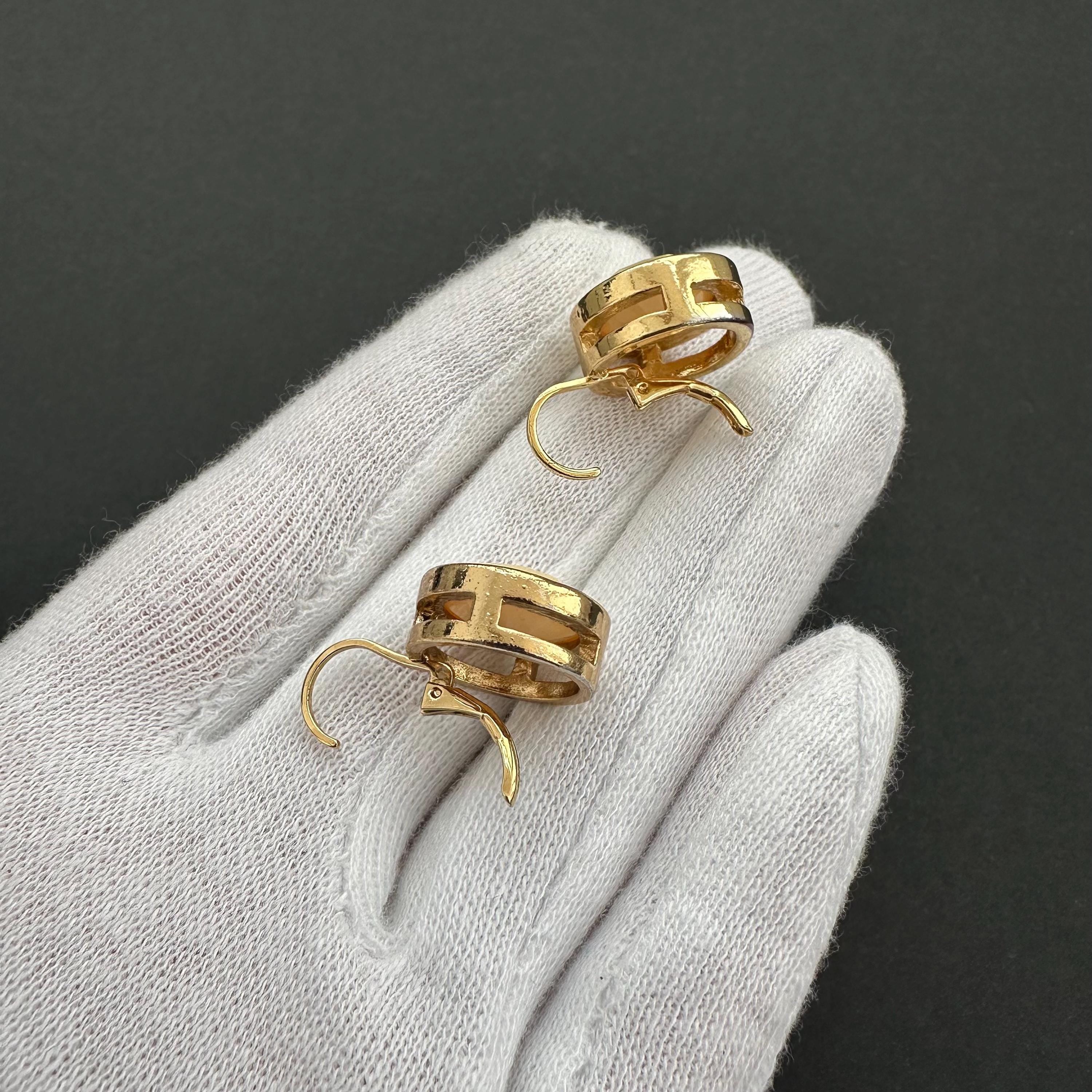 Vintage gold-tone and beige cabochons dangle openwork earrings
