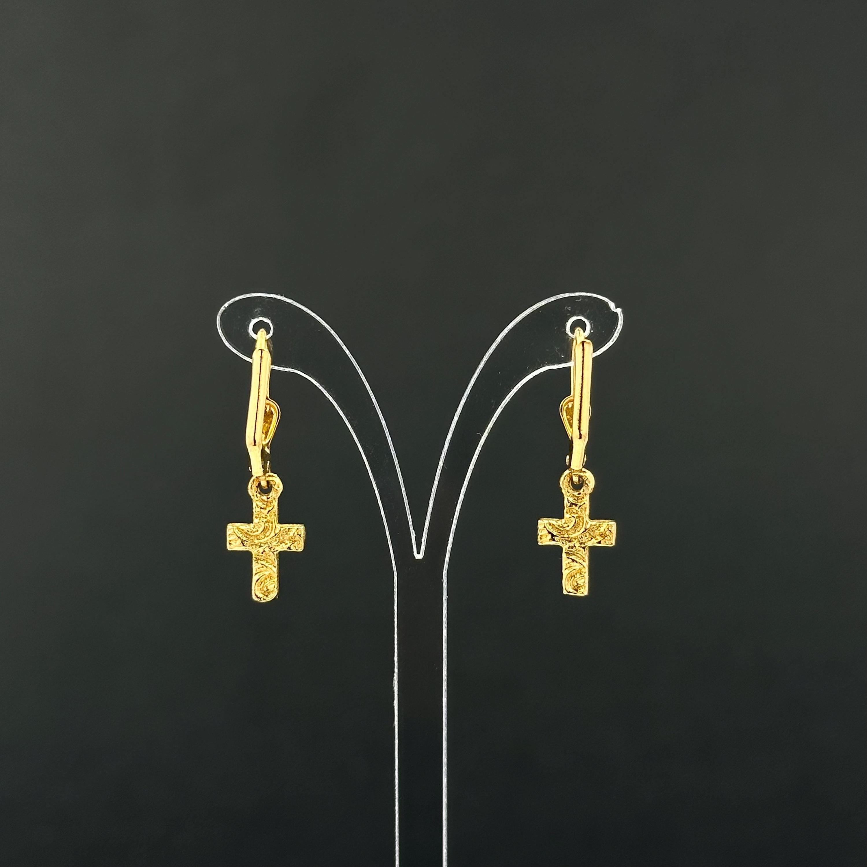 Vintage 1928 gold tone cross drop earrings with clear rhinestones