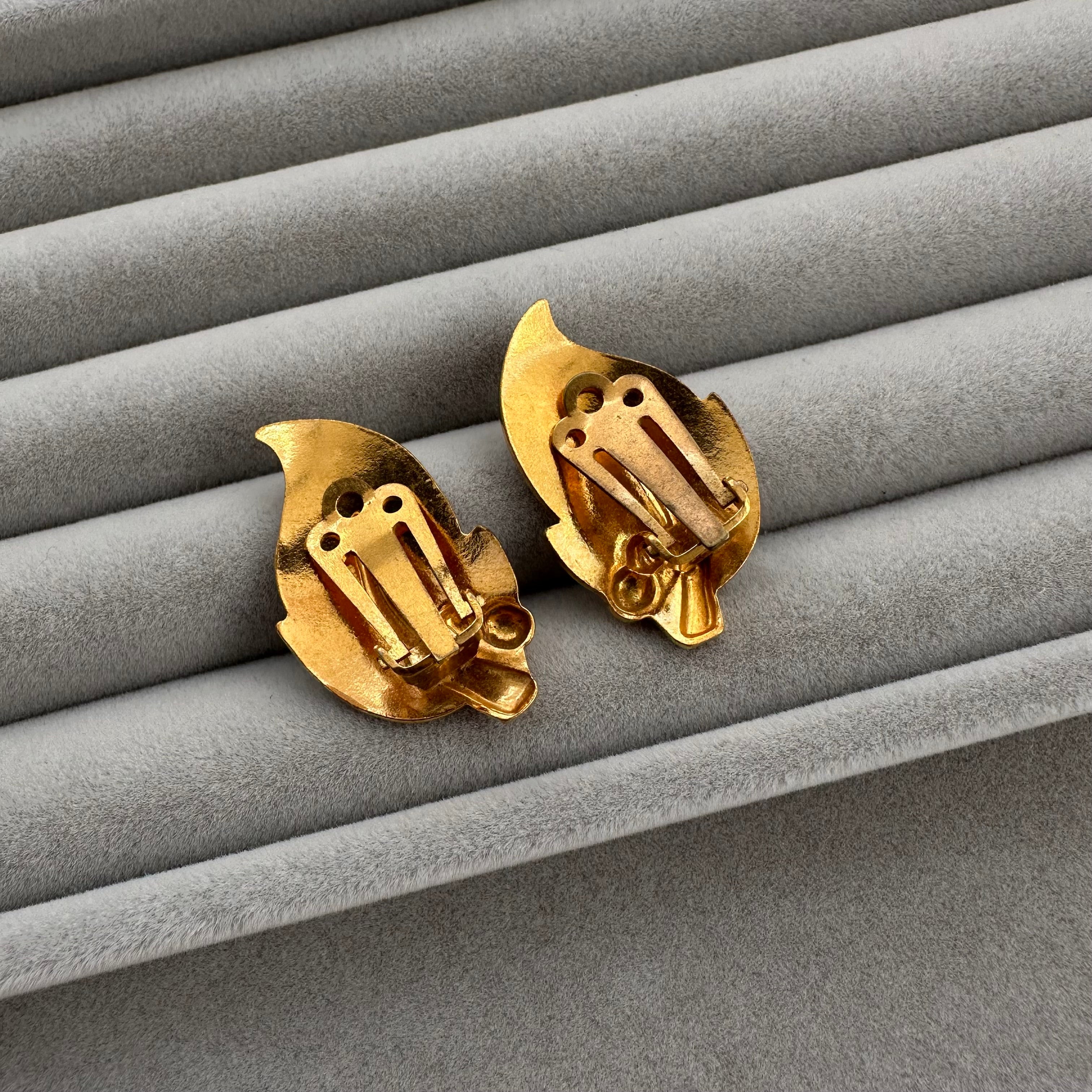 Vintage gold plated and beige enamel leaf clip on earrings.