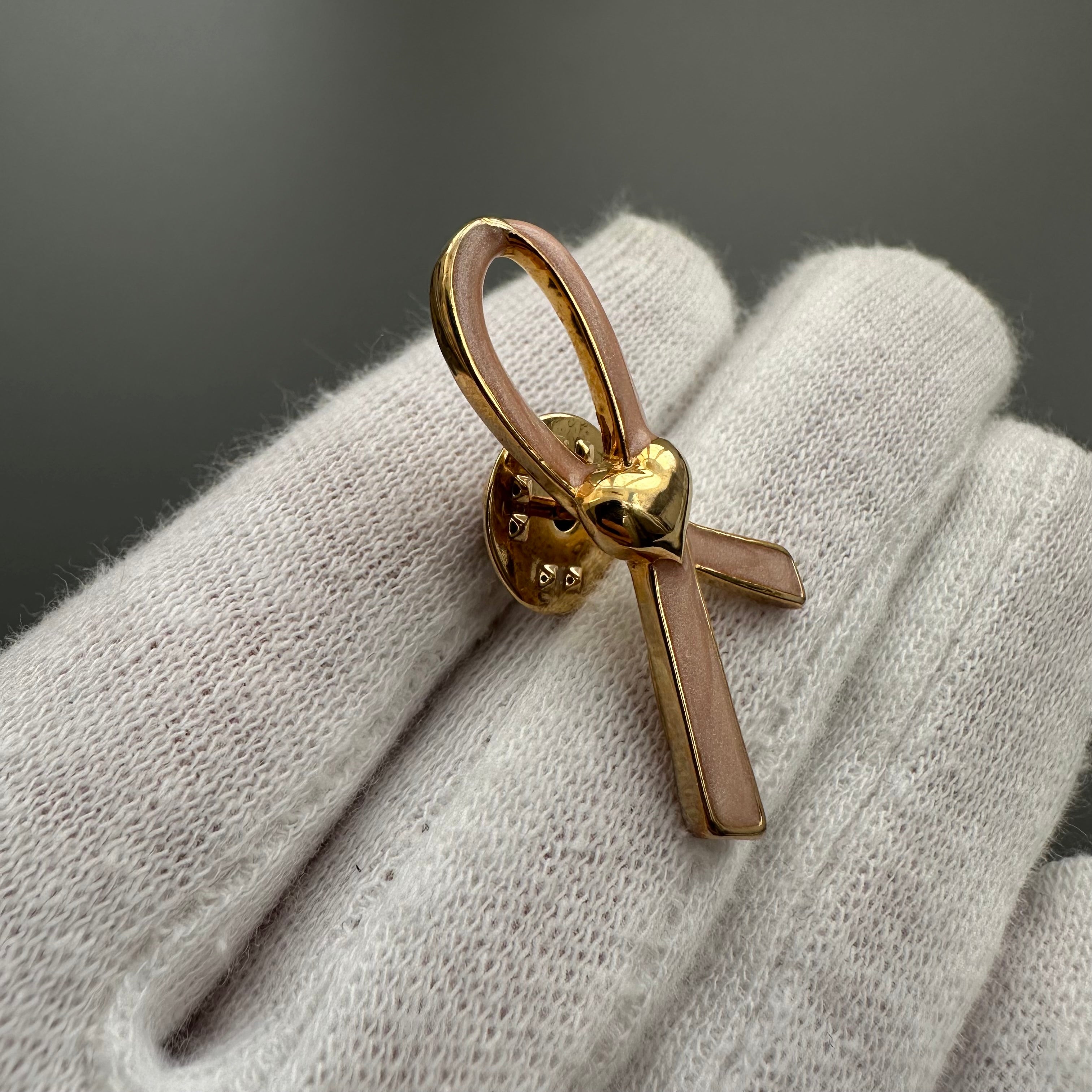 Vintage AVON gold tone and pink enamel ribbon heart lapel pin