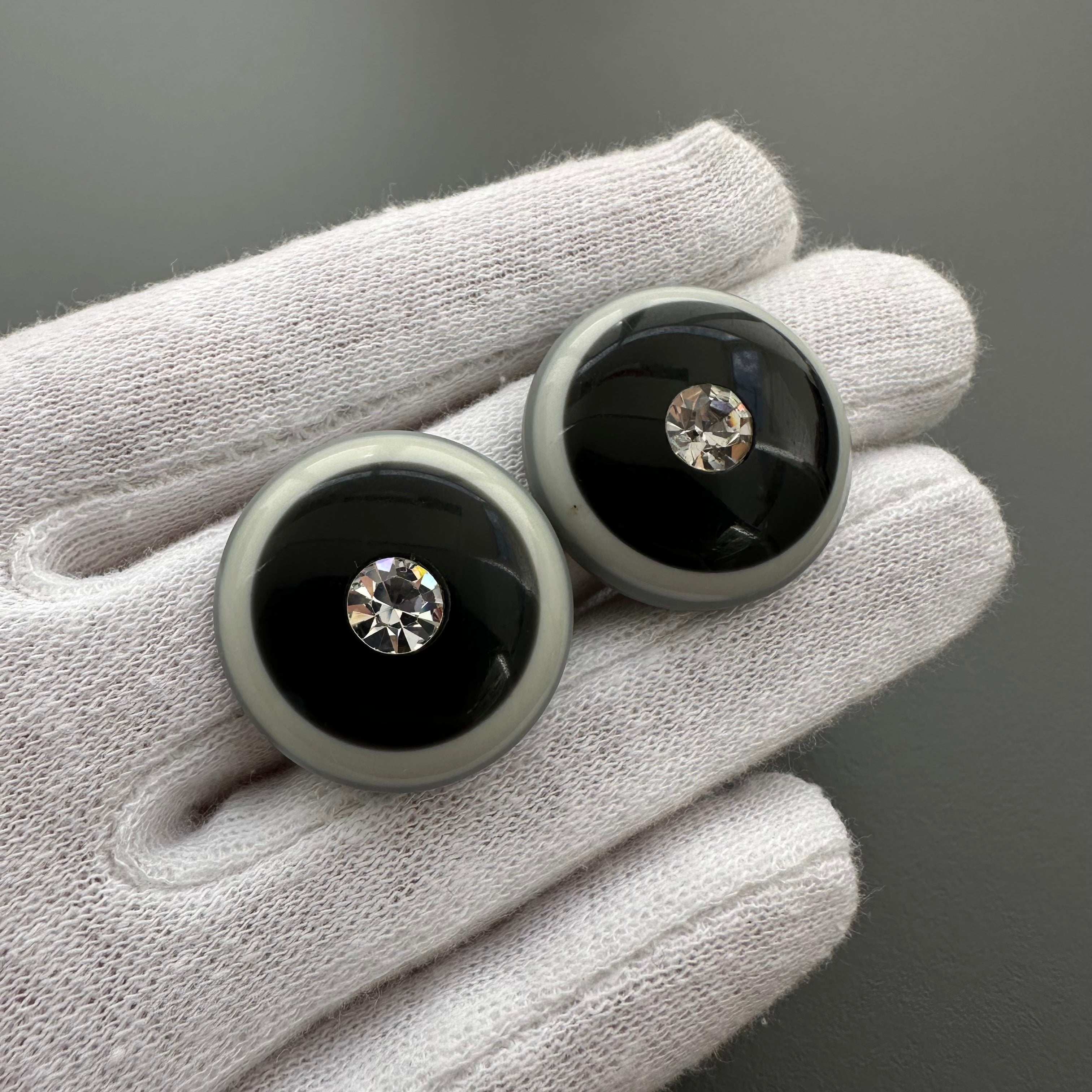 Vintage grey & black plastic round clip on earrings with clear crystal