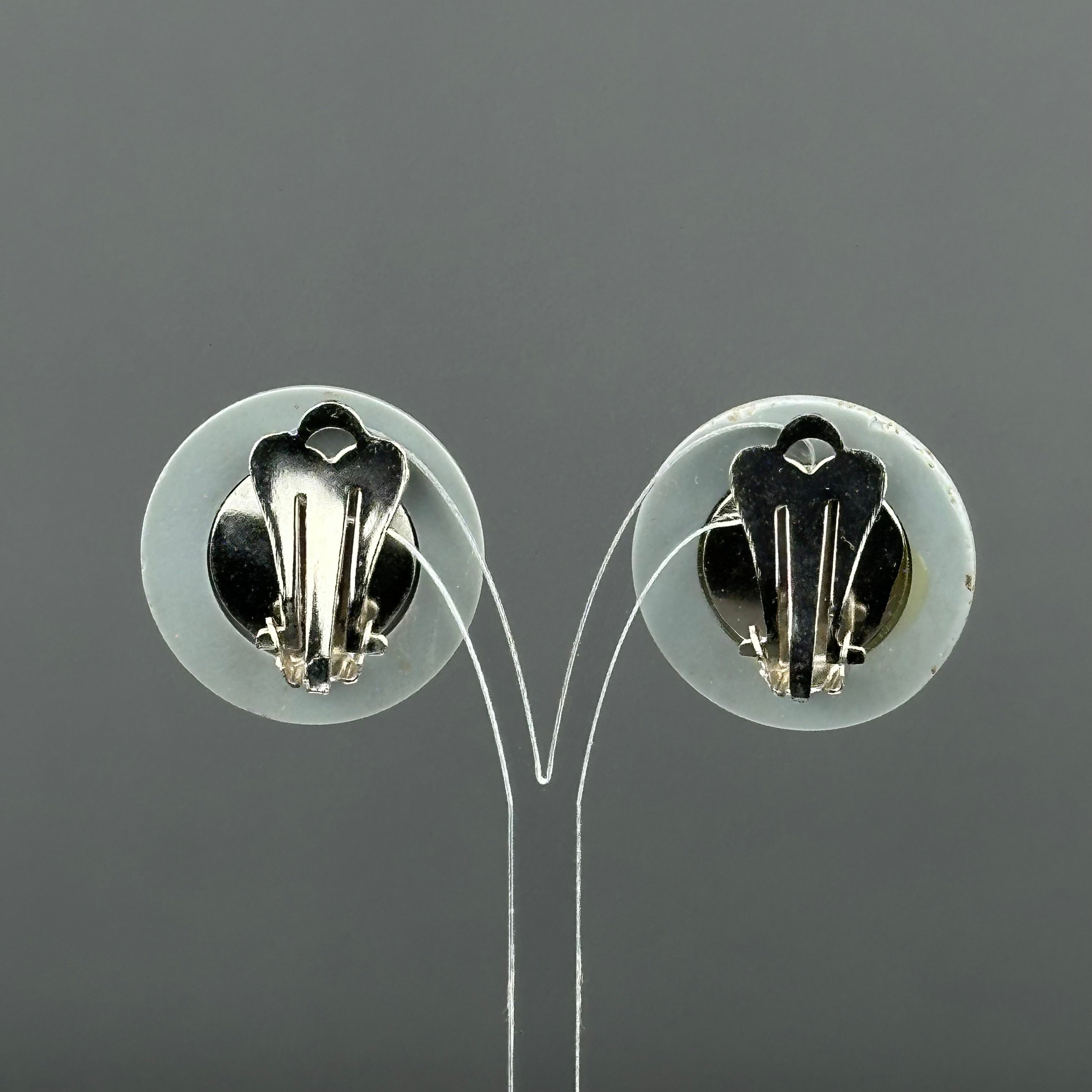 Vintage grey & black plastic round clip on earrings with clear crystal