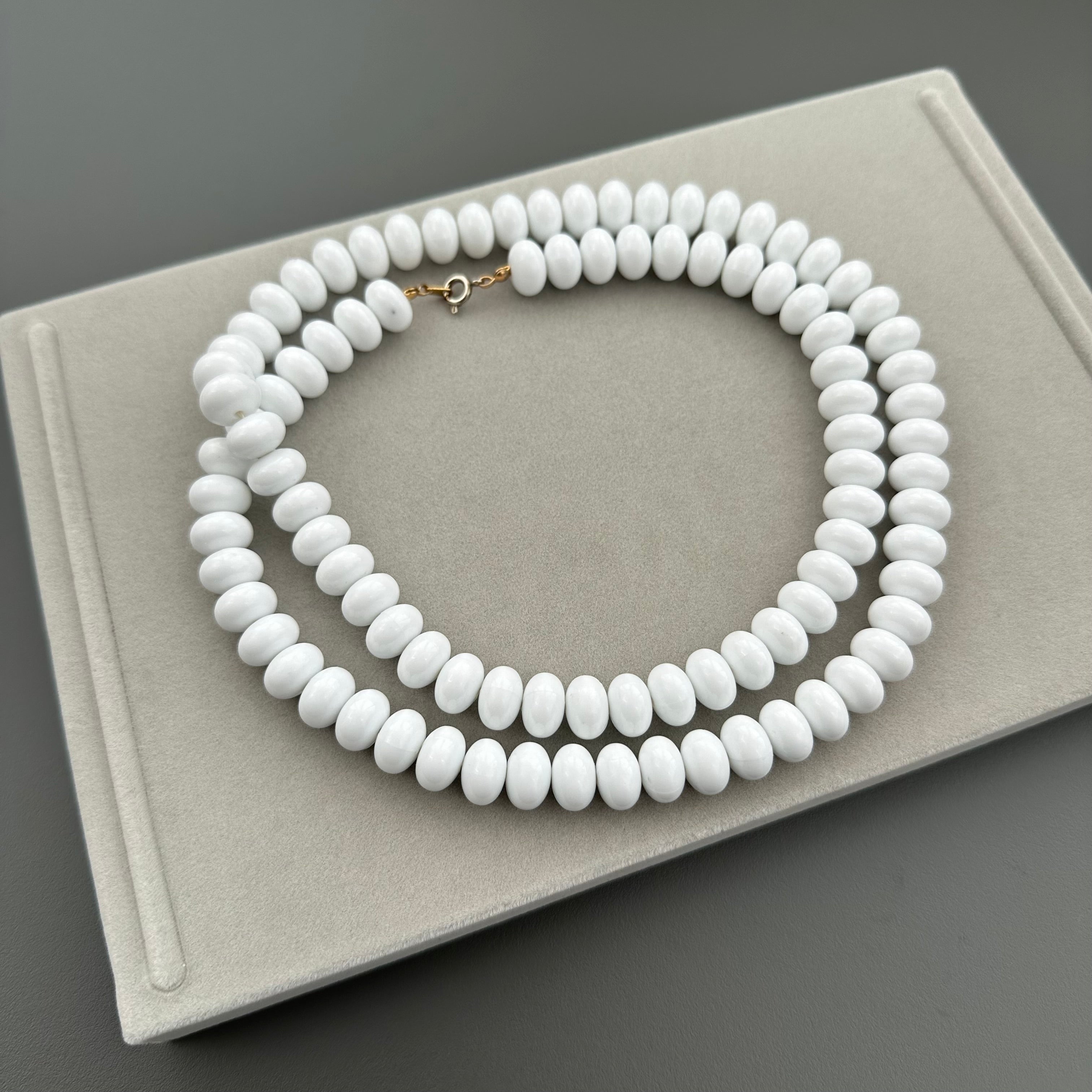 Vintage long white plastic bead necklace