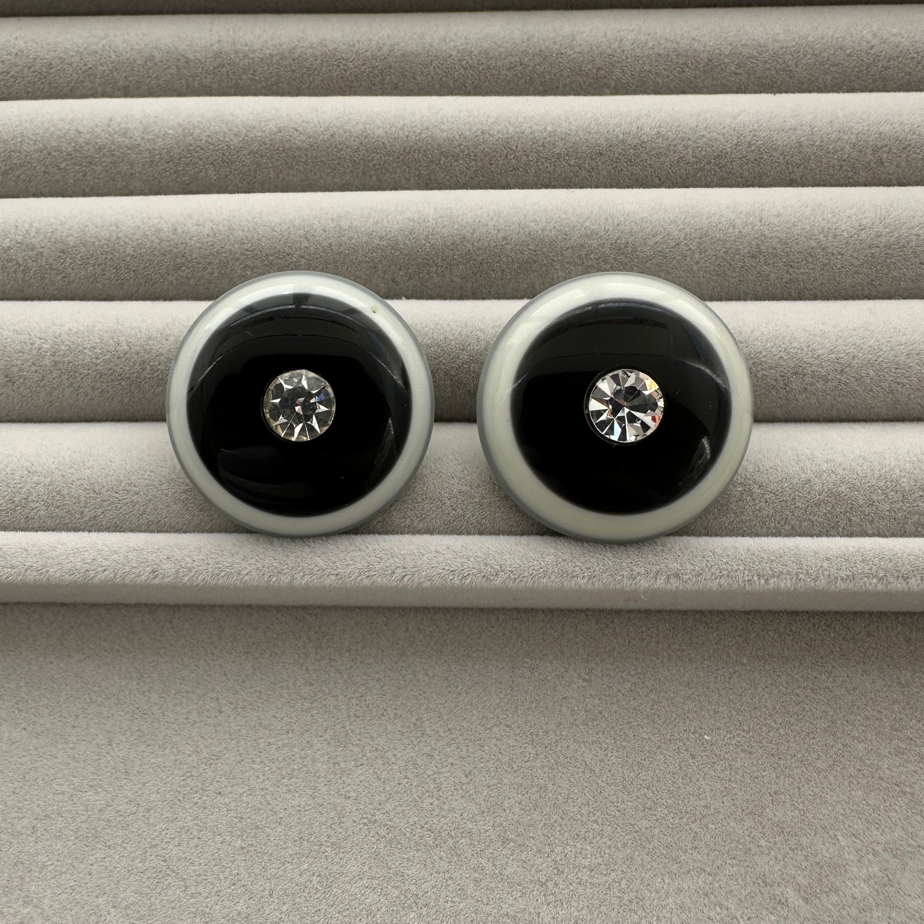 Vintage grey & black plastic round clip on earrings with clear crystal