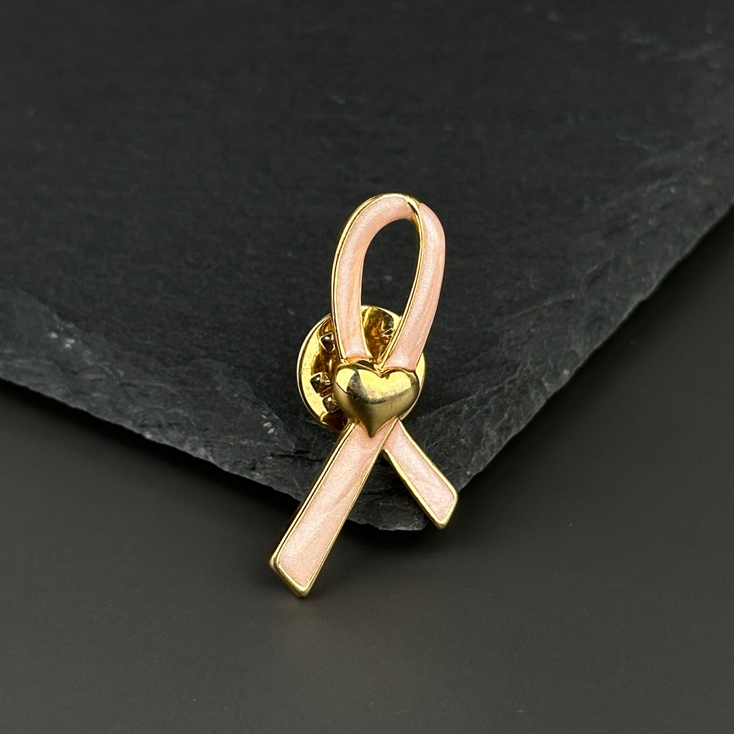 Vintage AVON gold tone and pink enamel ribbon heart lapel pin
