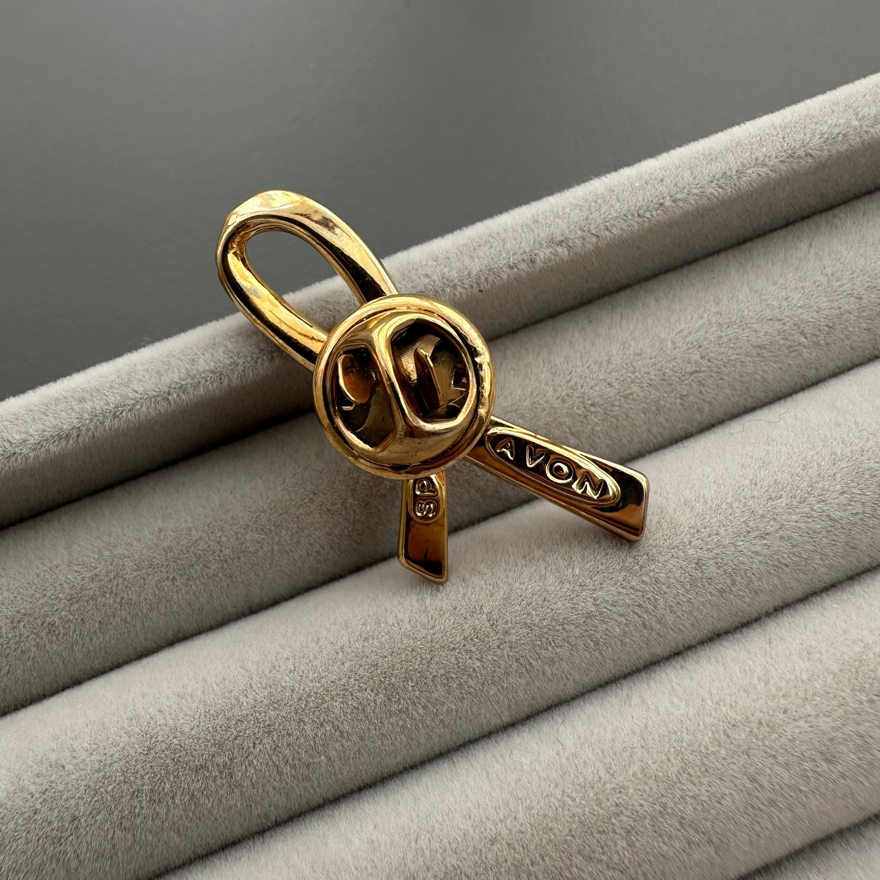 Vintage AVON gold tone and pink enamel ribbon heart lapel pin