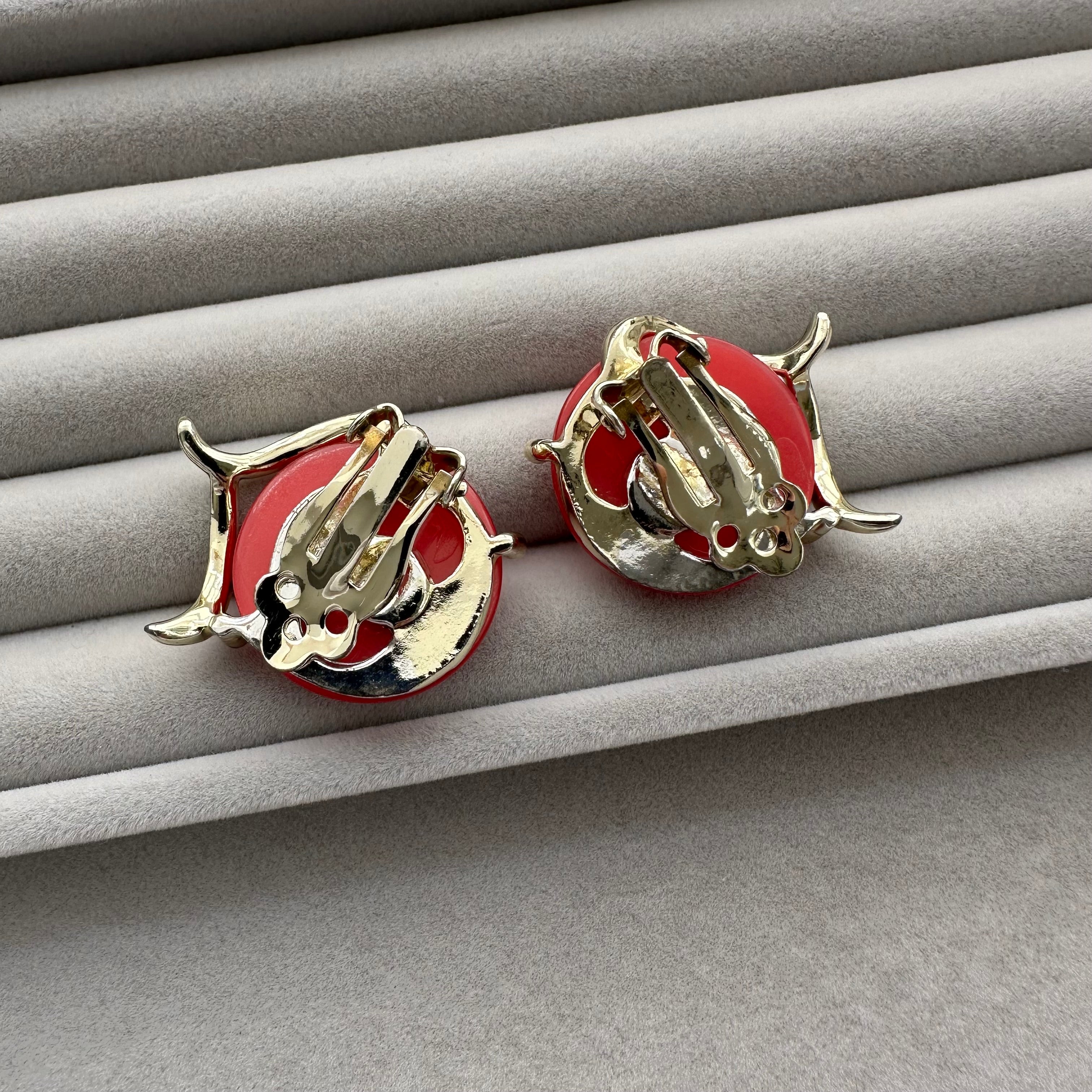 Vintage gold-tone and red lucite clip-on earrings
