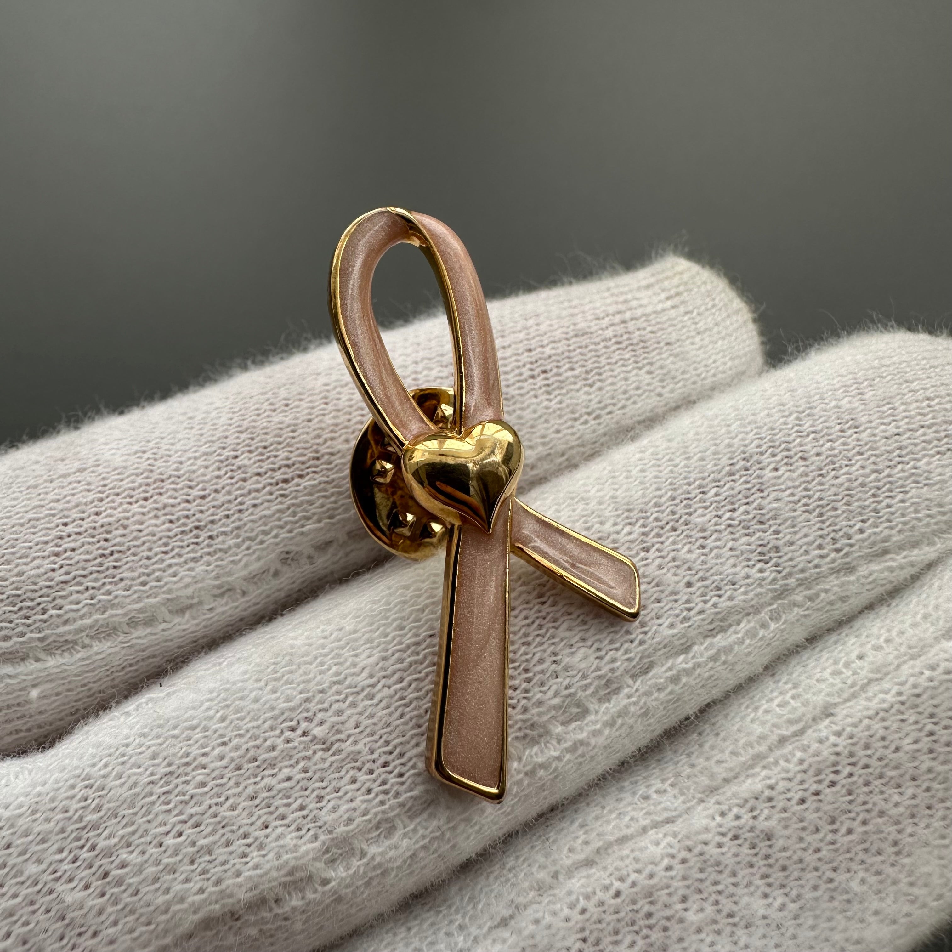 Vintage AVON gold tone and pink enamel ribbon heart lapel pin
