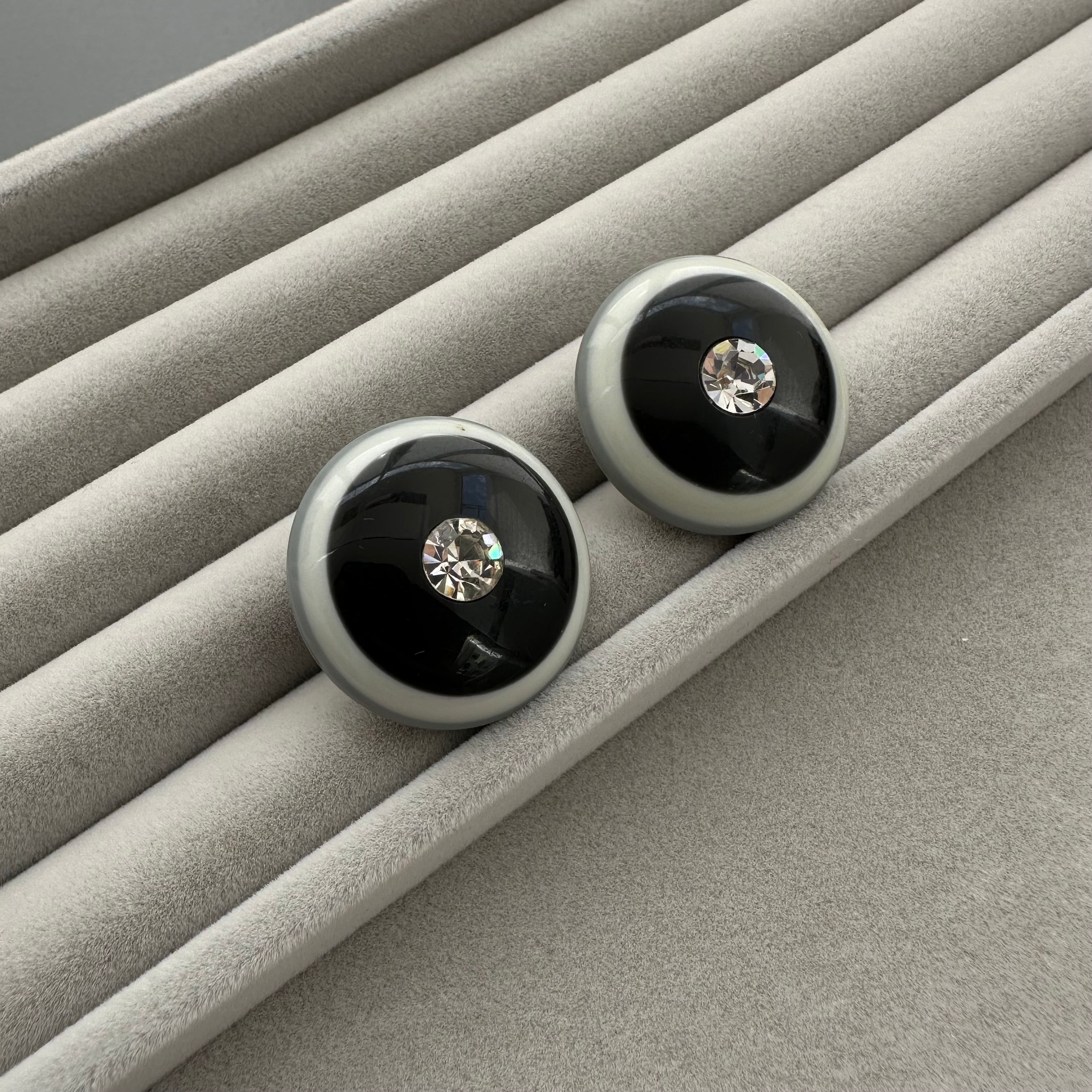 Vintage grey & black plastic round clip on earrings with clear crystal