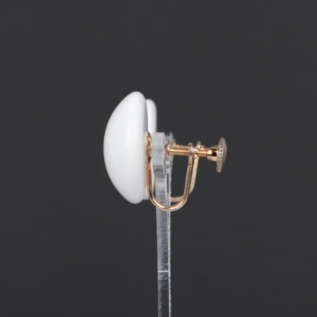 Vintage white plastic circle screw back earrings
