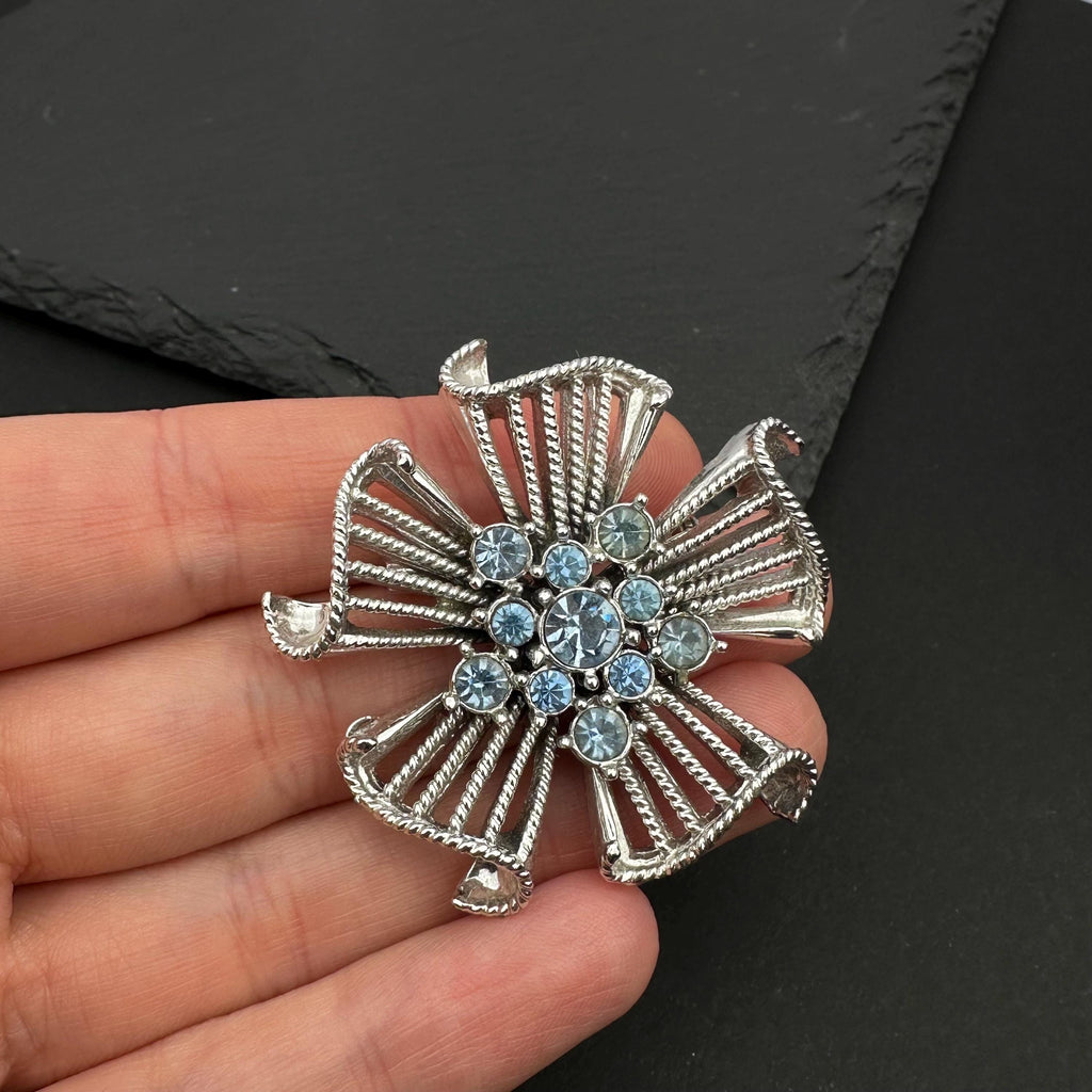 Vintage silver tone and blue rhinestone flower brooch