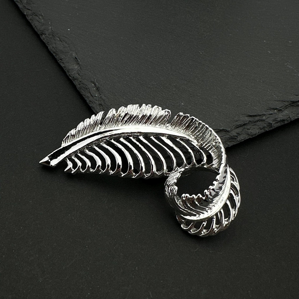 Vintage Gerry's silver tone feather brooch