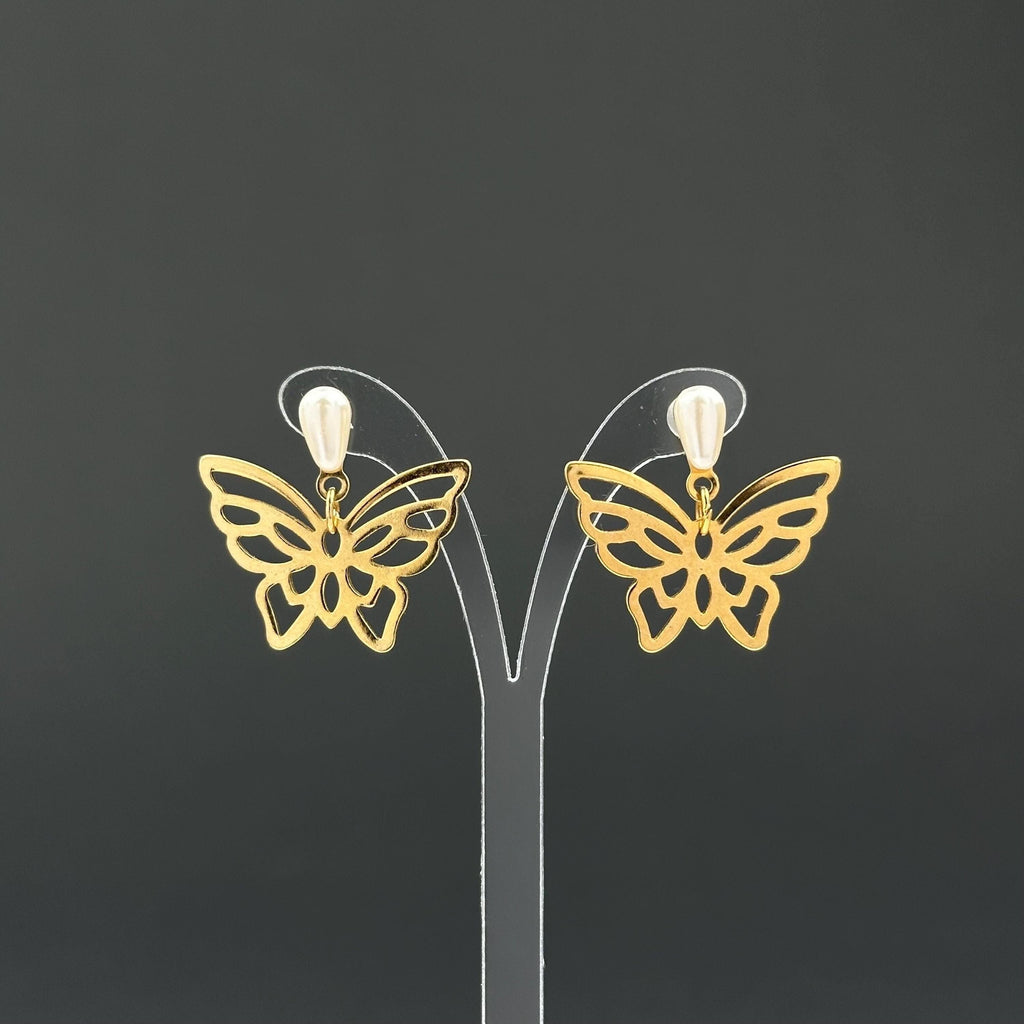Vintage gold-tone butterfly earrings with faux pearl