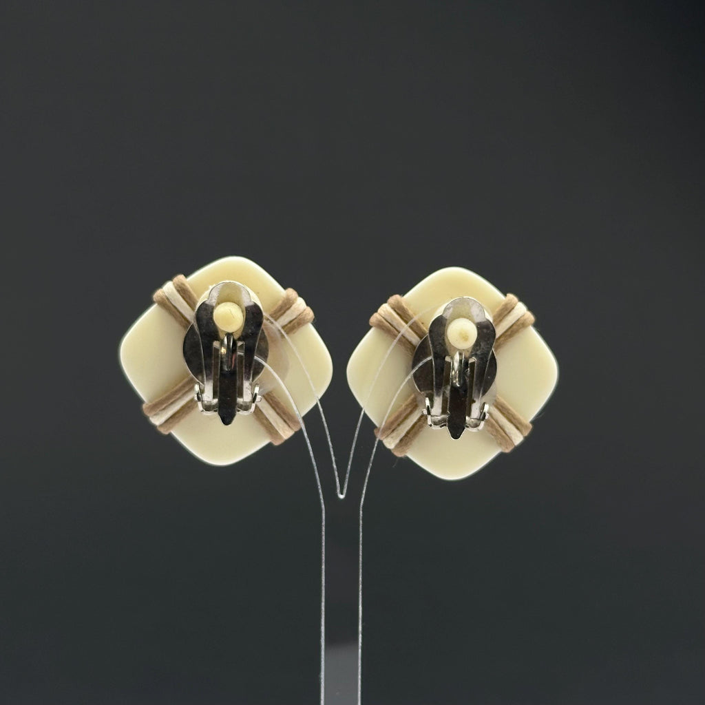 Vintage white plastic geometric clip on earrings