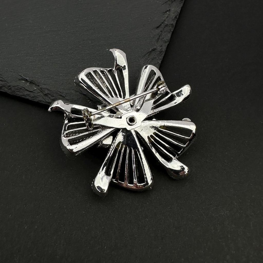 Vintage silver tone and blue rhinestone flower brooch