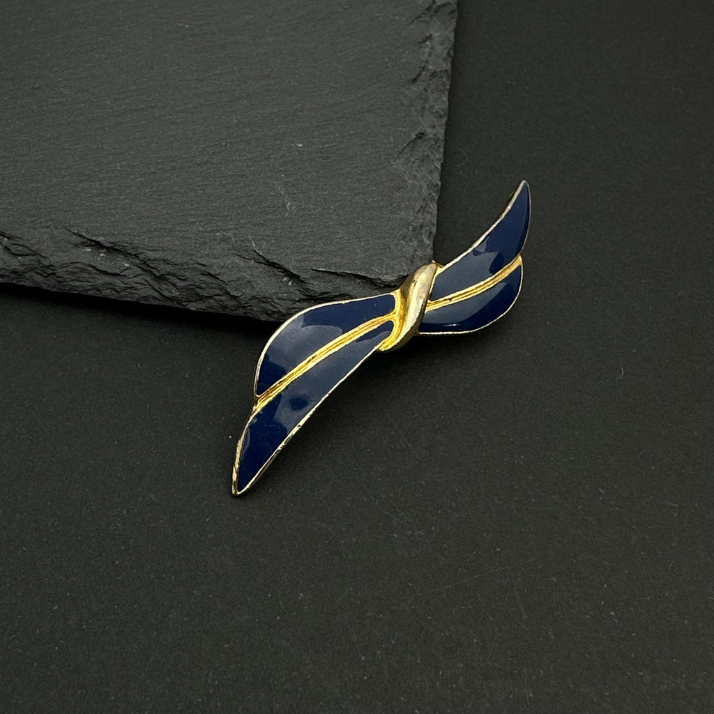 Vintage gold tone and navy enamel bow brooch