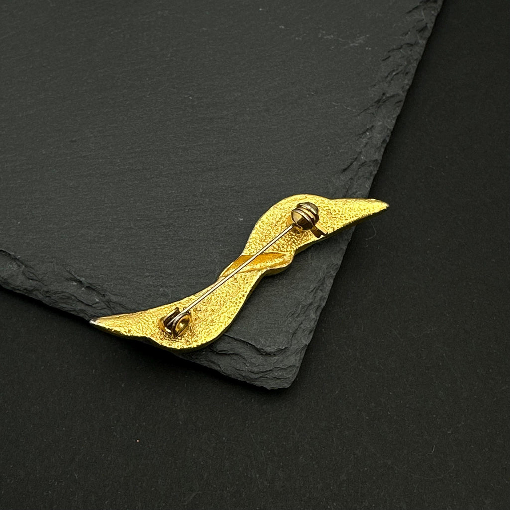 Vintage gold tone and navy enamel bow brooch