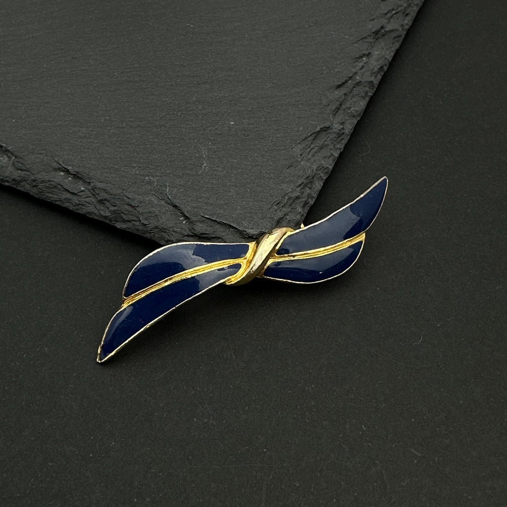Vintage gold tone and navy enamel bow brooch