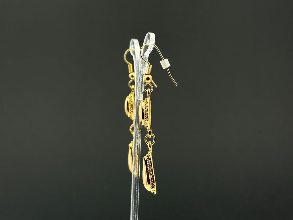 Vintage gold tone and beige swirl enamel dangle drop fishhook earrings