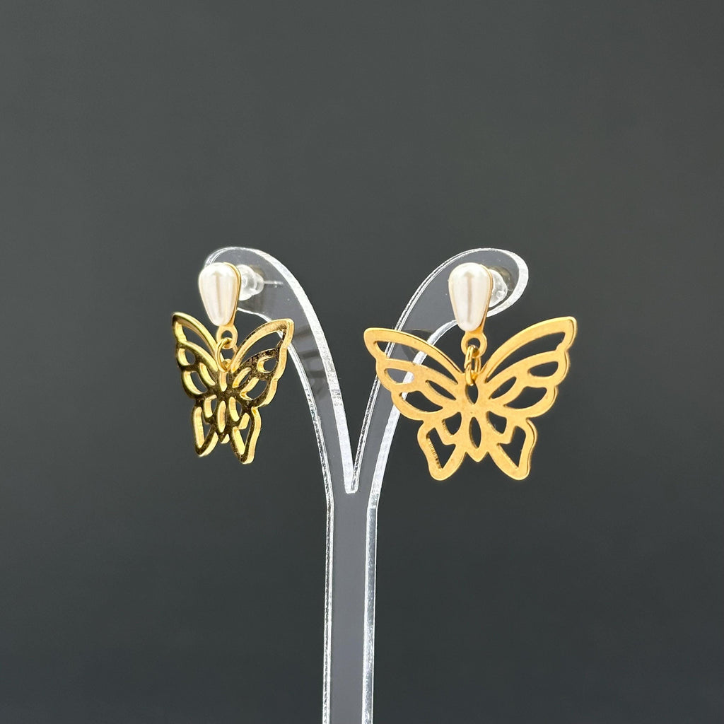 Vintage gold-tone butterfly earrings with faux pearl