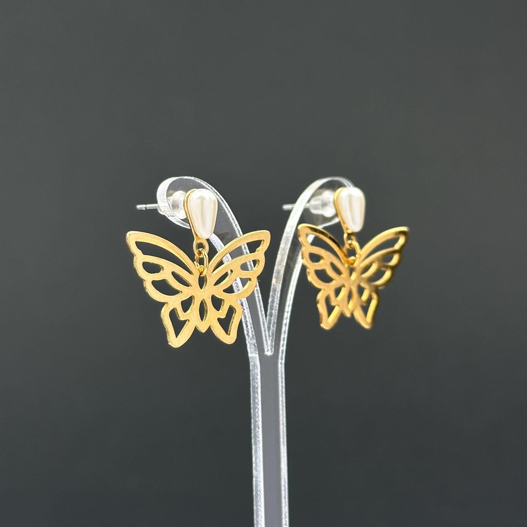 Vintage gold-tone butterfly earrings with faux pearl