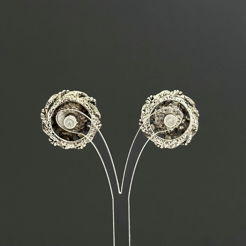 Vintage silver-tone round earrings with black plastic center