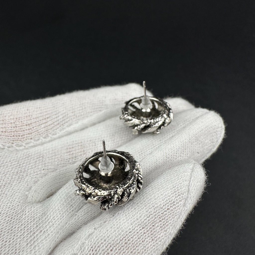 Vintage silver-tone round earrings with black plastic center