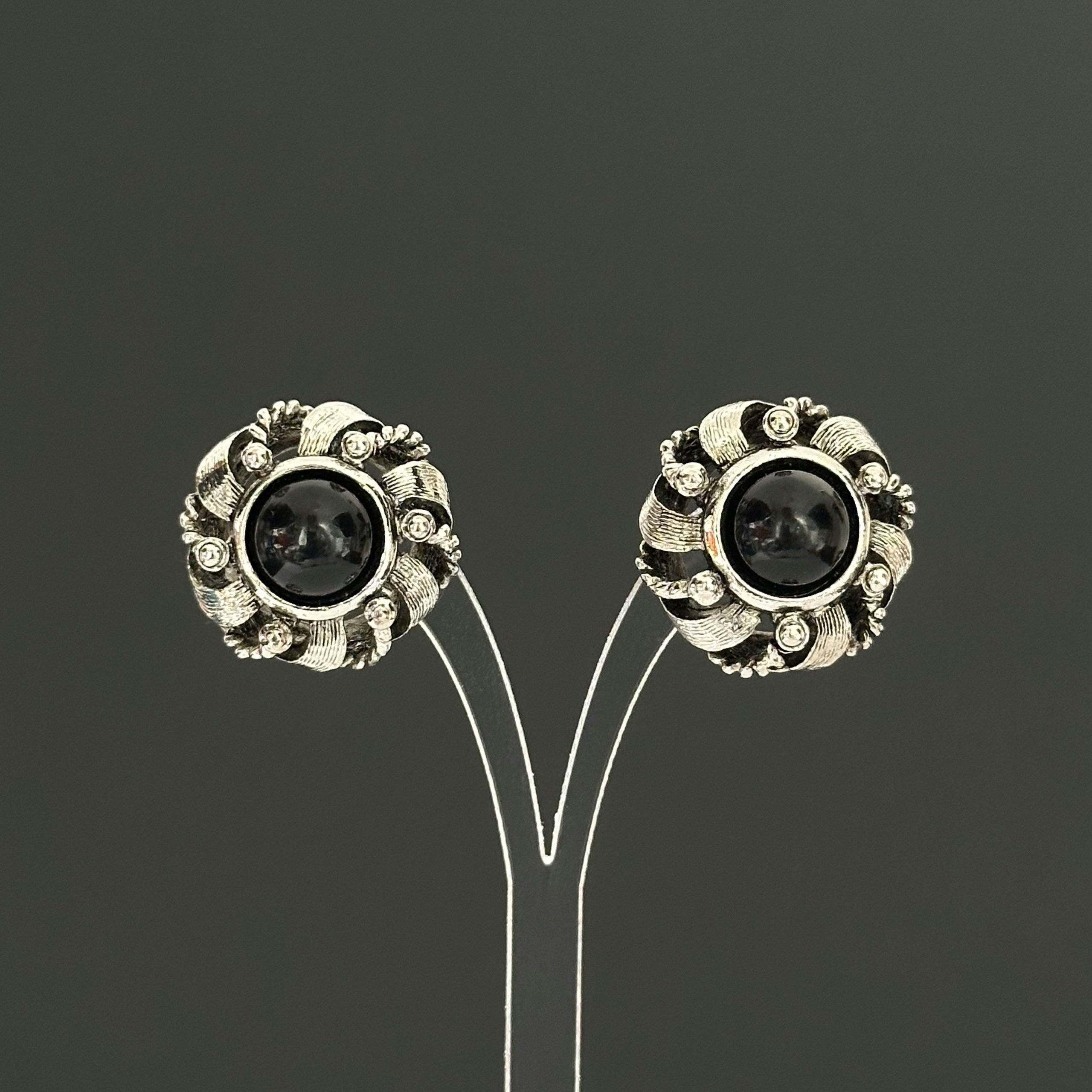 Vintage silver-tone round earrings with black plastic center