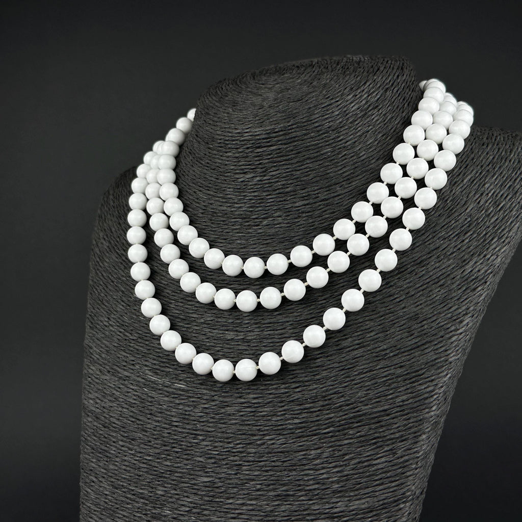 Vintage long white plastic bead necklace