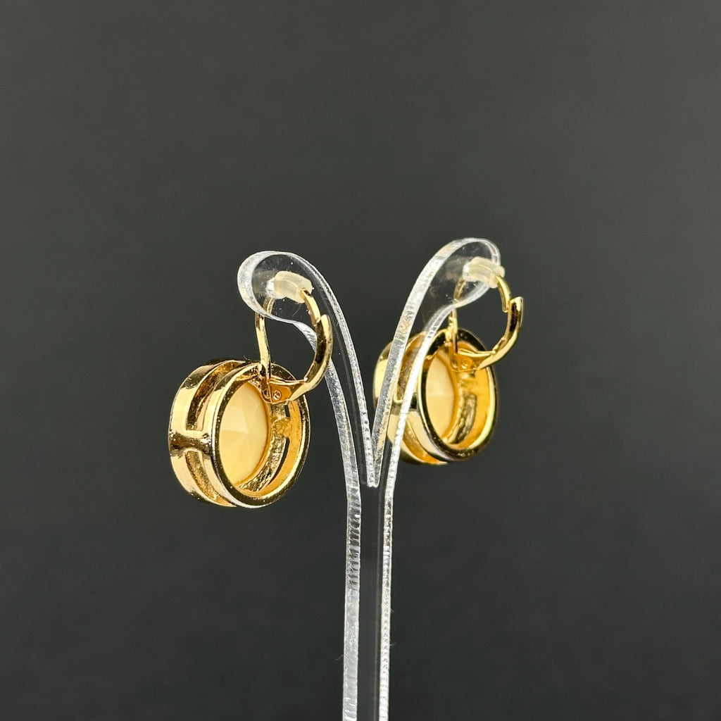 Vintage gold-tone and beige cabochons dangle openwork earrings