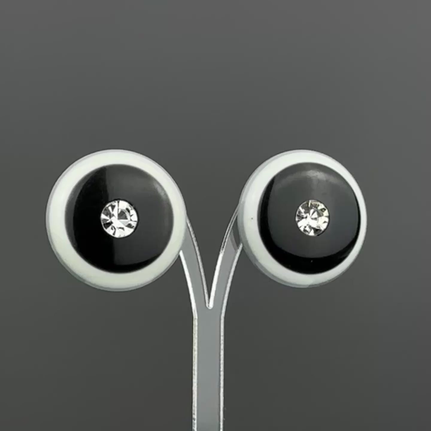 Vintage grey & black plastic round clip on earrings with clear crystal